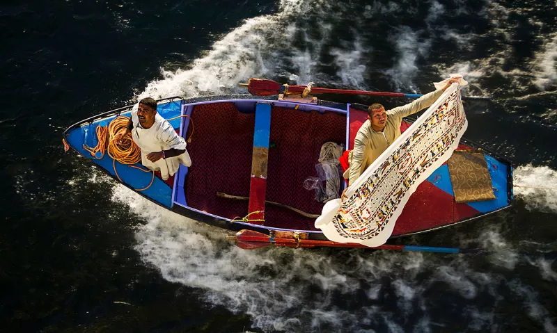 Textile-vendors-on-boat-in-Egypt-Photo-Mustafa-Shorbaji-2018-CGAP-Photo-Contest.jpg